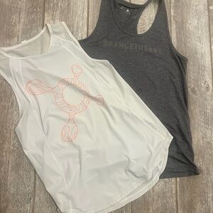 Lululemon Orange Theory White Tank Top and Grey Orange Theory tank.